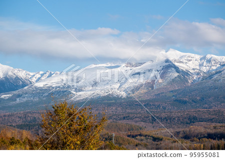 Snow-capped volcanic summit and autumn forest Mt. Tokachi Snow-capped volcanic summit and autumn forest Mt. Tokachi 95955081