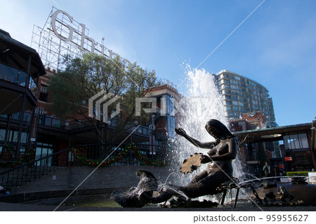 SAN FRANCISCO, CALIFORNIA, UNITED STATES - NOV 25th, 2018: Visitors in Ghirardelli Square with fountain.It's a famous landmark public square with shops and restaurants of San Francisco SAN FRANCISCO, CALIFORNIA, UNITED STATES - NOV 25th, 2018: Visitors in Ghirardelli Square with fountain.It's a famous landmark public square with shops and restaurants of San Francisco 95955627