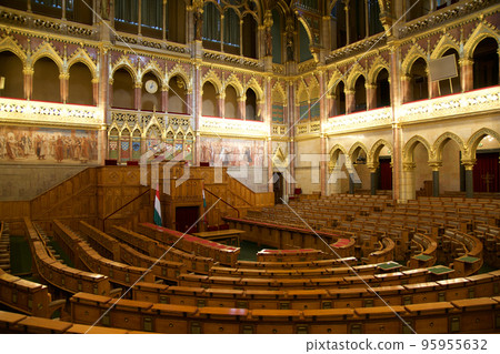 BUDAPEST, HUNGARY - 03 MAR 2019: Interior of the Budapest Parliament building and the meeting room of the Hungarian government with a lot of wood applications BUDAPEST, HUNGARY - 03 MAR 2019: Interior of the Budapest Parliament building and the meeting room of the Hungarian government with a lot of wood applications 95955632