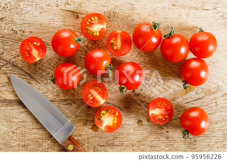 Fresh tomatoes on wooden table. Fresh tomatoes on wooden table. 95956226