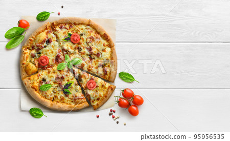 Hot supreme pizza on white wooden table with tomatoes and basil flat lay. Hot supreme pizza on white wooden table with tomatoes and basil flat lay. 95956535