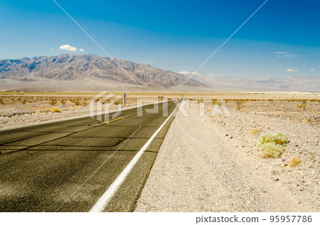 Hot desert road in Death Valley National Park, USA 95957786