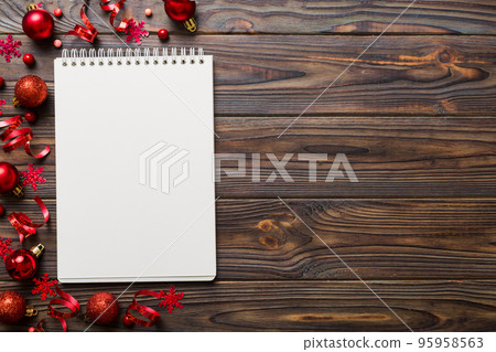 Christmas blank greeting card mock-up scene. Creative layout made of Christmas tree branches and paper card note. Flat lay. Nature New Year concept 95958563