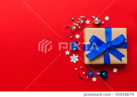 Top view Flat lay Christmas decorations and gift box on colored background with copy space. Christmas or Happy New Year composition 95958679