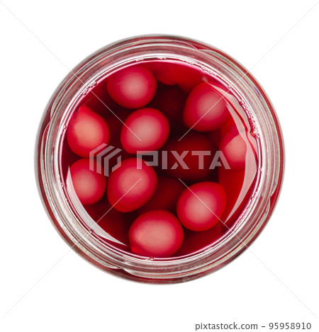 Homemade compote of blue grapes, in an open preserving jar, isolated, from above, on white background. Blue grapes fresh from the garden, boiled with sugar to preserve it for winter. Macro food photo. 95958910
