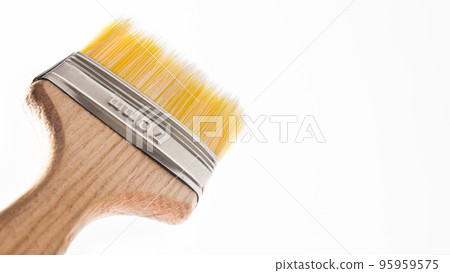 A paint brush on a gray background with a place for text to paint walls and objects with paint. Tools for repair. A paint brush on a gray background with a place for text to paint walls and objects with paint. Tools for repair. 95959575