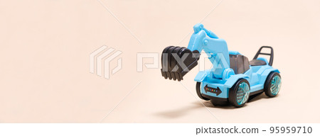 Blue excavator plastic machine on white background. Construction machinery car for digging for toy store and children. Blue excavator plastic machine on white background. Construction machinery car for digging for toy store and children. 95959710