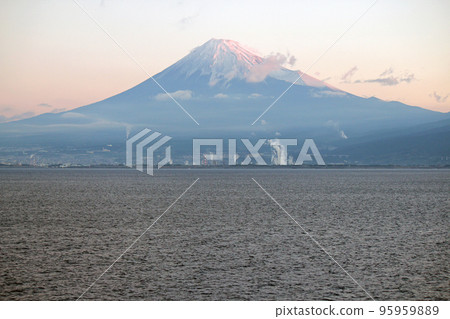 Mt.Fuji bathed in the morning light seen from a cruise ship navigating Suruga Bay 95959889