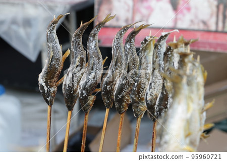 Salt-grilled sweetfish skewers sold at food stalls Salt-grilled sweetfish skewers sold at food stalls 95960721