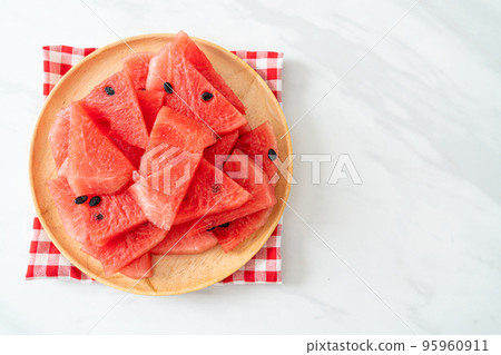 fresh watermelon sliced on plate 95960911