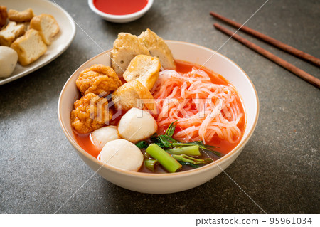 small flat rice noodles with fish balls and shrimp balls in pink soup, Yen Ta Four or Yen Ta Fo 95961034