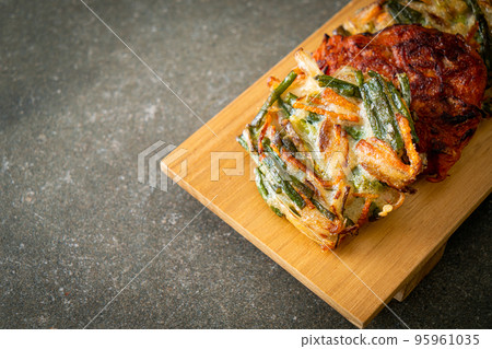 Pajeon or Korean pancake and Korean Kimchi pancake or Kimchijeon on white background Pajeon or Korean pancake and Korean Kimchi pancake or Kimchijeon on white background 95961035