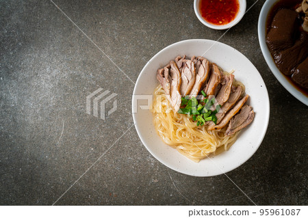 dried duck noodles in white bowl 95961087