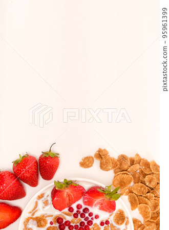 Cereals drenched in milk - quick breakfast with fruits and berries, top view, place for text 95961399