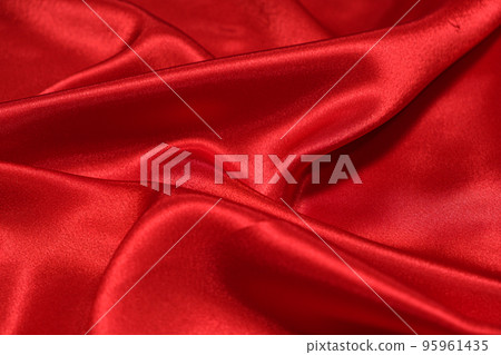 Texture of crumpled red satin fabric, beautiful pattern. 95961435