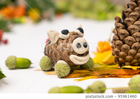 Pig figurine made of cone and plasticine, children's crafts. Pig figurine made of cone and plasticine, children's crafts. 95961460