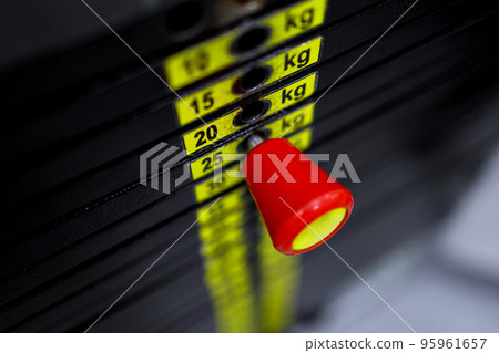 Numbers of weights on the gym machine for lifting Numbers of weights on the gym machine for lifting 95961657