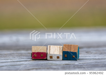 Three cute little wooden houses 95962492