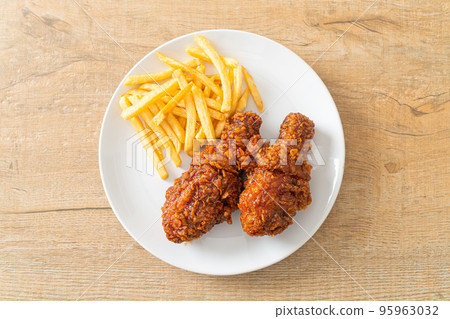 spicy Korean fried chicken with fries spicy Korean fried chicken with fries 95963032