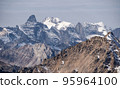 Severe mountains peaks covered by snow 95964100