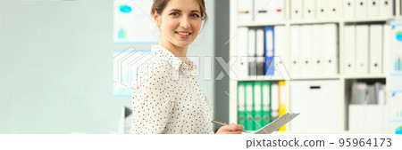 Cute smiling woman posing in conference room 95964173