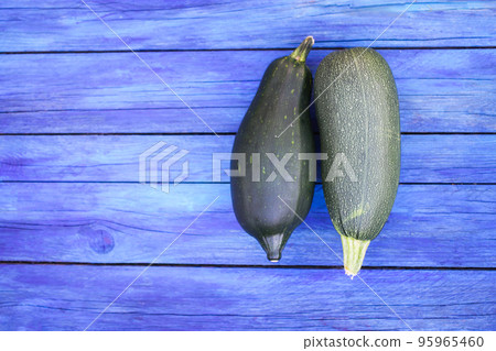 Zucchini on wooden boards outdoors Zucchini on wooden boards outdoors 95965460
