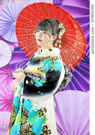 An adult woman wearing a kimono with a turquoise pattern on a white background, kimono studio photography, coming-of-age ceremony An adult woman wearing a kimono with a turquoise pattern on a white background, kimono studio photography, coming-of-age ceremony 95966269