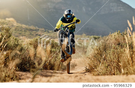 Mountain biker, dirt bike and dessert rider cycling on sports bicycle on nature path, dirt road and extreme sport performance. Adventure race competition, outdoor racer and cycling in Australia sand 95966329