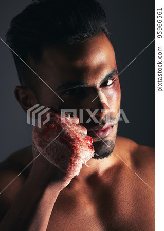 Violence, man and portrait with blood fist of angry fighter with bruise, injury and wound plaster. Boxer, fitness and anger aggression of mma person with intense dark studio shadow background. Violence, man and portrait with blood fist of angry fighter with bruise, injury and wound plaster. Boxer, fitness and anger aggression of mma person with intense dark studio shadow background. 95966561