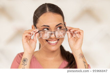 Glasses, vision and thinking with a woman customer in an optometry store to buy prescription lenses. Eyewear, idea and retail with a female consumer shopping for frame spectacles at an optometrist Glasses, vision and thinking with a woman customer in an optometry store to buy prescription lenses. Eyewear, idea and retail with a female consumer shopping for frame spectacles at an optometrist 95966847
