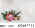 New Year clock with fir branch holiday card on light winter background 95967743