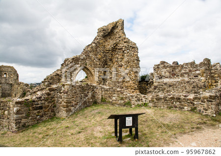 A crumbling historic building, the old castle of Hastings on the outskirts of London 95967862