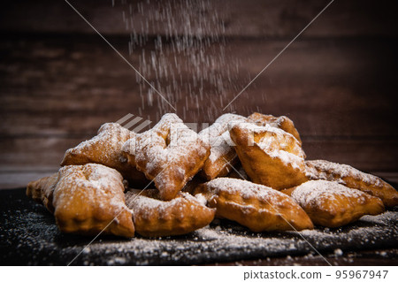 TRADITIONAL WONDERS OF SOUTH-WESTERN FRANCE, SPRINKLED WITH ICING SUGAR AND FLAVOURED WITH RUM AND 95967947