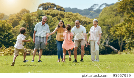 Big family, nature park and happy to play with children running on grass with senior grandparents, mom and dad smile in summer sunshine. Fun mother, father and open arms to hug kids outdoors together Big family, nature park and happy to play with children running on grass with senior grandparents, mom and dad smile in summer sunshine. Fun mother, father and open arms to hug kids outdoors together 95967959