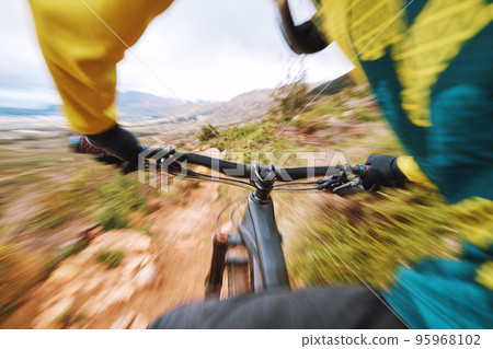 Mountain bike, fast and hands cycling with speed on nature trail for bicycle fitness, race or workout. Bike, action and cyclist man with blur movement and motion on outdoor adventure 95968102