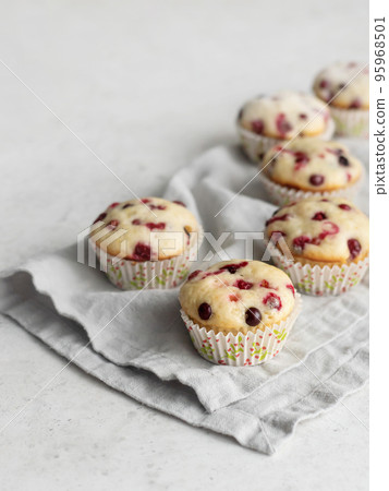 Cranberry muffins on linen napkin with text space Cranberry muffins on linen napkin with text space 95968501