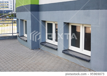 Plastic windows from the basement outside closeup 95969873