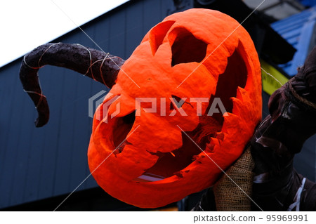 Helloween Pumpkin Head in orange paint with long tail Helloween Pumpkin Head in orange paint with long tail 95969991