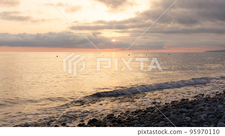 Amazing beach sunset over Black Sea. Lazarevskoye, Sochi, Russia Amazing beach sunset over Black Sea. Lazarevskoye, Sochi, Russia 95970110