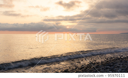 Amazing beach sunset over Black Sea. Lazarevskoye, Sochi, Russia Amazing beach sunset over Black Sea. Lazarevskoye, Sochi, Russia 95970111