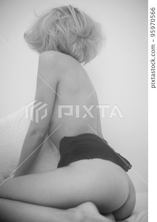 Young nude girl in home interior. 95970566