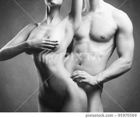 beautiful young couple posing nude in photo studio 95970569