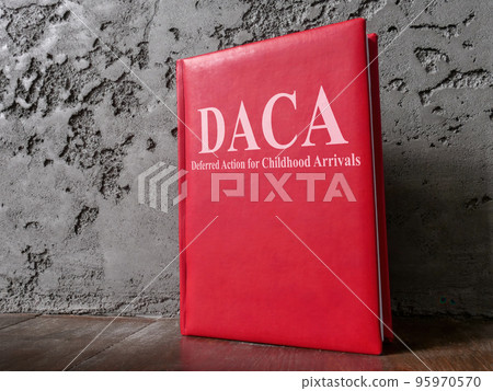 Book Deferred Action for Childhood Arrivals DACA law near the wall. 95970570