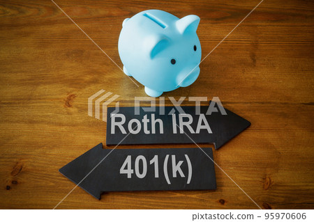 Piggy bank and arrows with signs Roth IRA and 401k retirement plan. 95970606