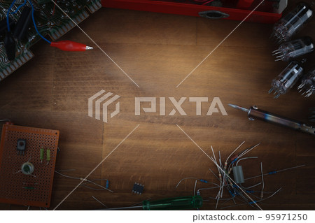 DIY. Do it yourself. Workplace with soldering iron, tools and electronic components concept background DIY. Do it yourself. Workplace with soldering iron, tools and electronic components concept background 95971250