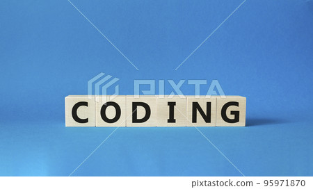 Coding symbol. Concept word Coding on wooden cubes. Beautiful blue background. Business and Coding concept. Copy space. 95971870