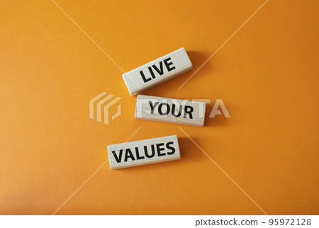 Live your values symbol. Concept words Live your values on wooden blocks. Beautiful orange background. Business and Live your values concept. Copy space. Live your values symbol. Concept words Live your values on wooden blocks. Beautiful orange background. Business and Live your values concept. Copy space. 95972128