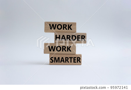 Work harder Work smarter symbol. Wooden blocks with words Work harder Work smarter. Beautiful white background. Business concept. Copy space. Work harder Work smarter symbol. Wooden blocks with words Work harder Work smarter. Beautiful white background. Business concept. Copy space. 95972141
