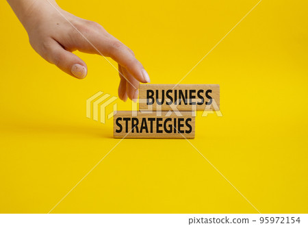 Business loan symbol. Concept words business loan on wooden blocks. Beautiful yellow background. Businessman hand. Business and business loan concept. Copy space. 95972154