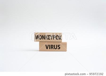 Monkeypox virus symbol. Concept word Monkeypox virus on wooden blocks. Beautiful white background. Medicine and Monkeypox virus concept. Copy space Monkeypox virus symbol. Concept word Monkeypox virus on wooden blocks. Beautiful white background. Medicine and Monkeypox virus concept. Copy space 95972192